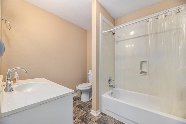 full bath featuring toilet, a textured ceiling, shower / bathing tub combination, baseboards, and vanity