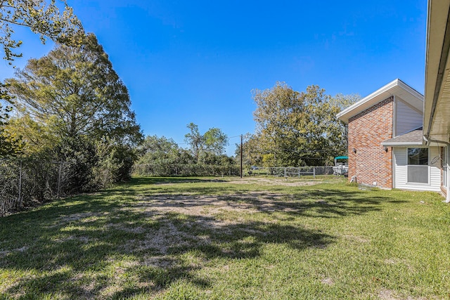 view of yard featuring fence