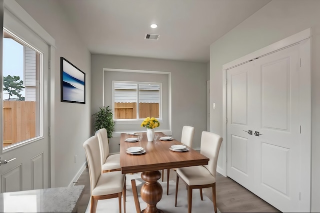 dining room featuring hardwood / wood-style flooring and plenty of natural light