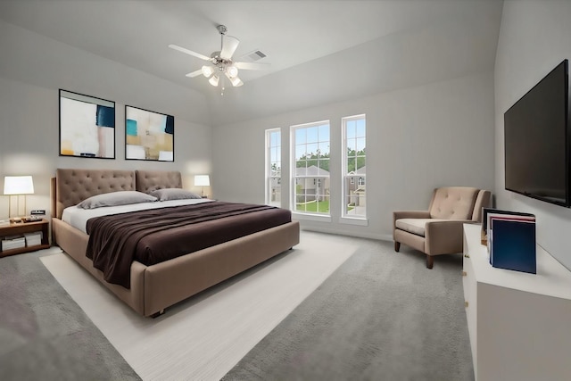 carpeted bedroom featuring lofted ceiling and ceiling fan