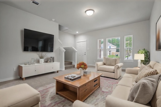 living room featuring light colored carpet