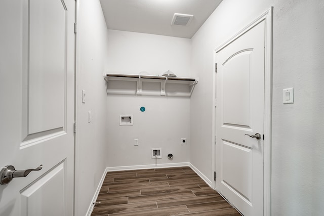 laundry area featuring gas dryer hookup, hookup for a washing machine, hookup for an electric dryer, and hardwood / wood-style flooring