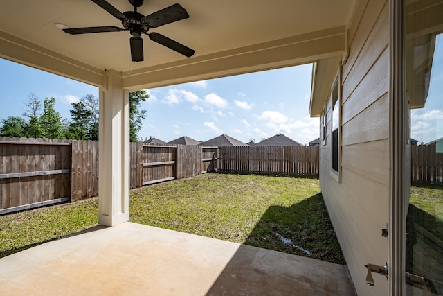 view of yard with a patio and ceiling fan