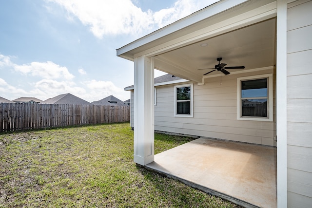 view of yard with a patio and ceiling fan