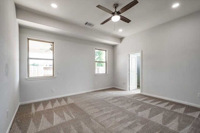 carpeted empty room with ceiling fan