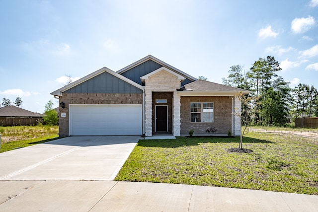 view of front of house featuring a garage and a front lawn