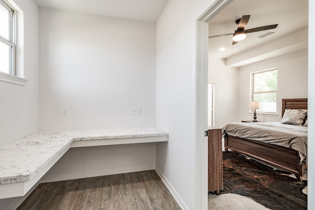 bedroom featuring ceiling fan and dark hardwood / wood-style flooring