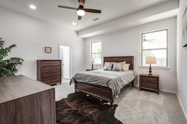 bedroom featuring light carpet and ceiling fan