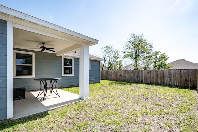 view of yard with a patio and ceiling fan