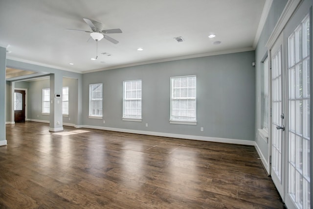 spare room featuring crown molding, dark hardwood / wood-style flooring, and ceiling fan