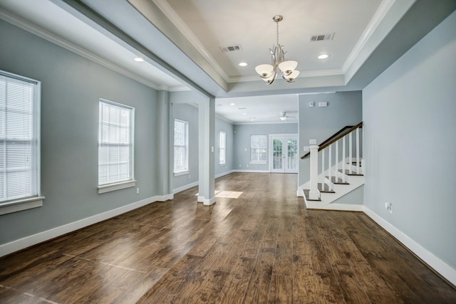 foyer entrance featuring a chandelier, ornamental molding, dark hardwood / wood-style flooring, and a tray ceiling