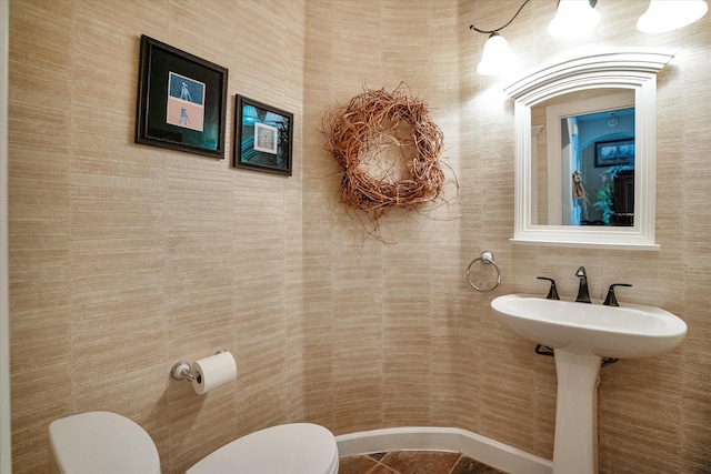 bathroom featuring tile patterned floors and toilet