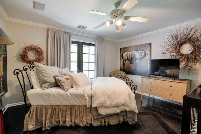 bedroom featuring ceiling fan, a textured ceiling, and ornamental molding