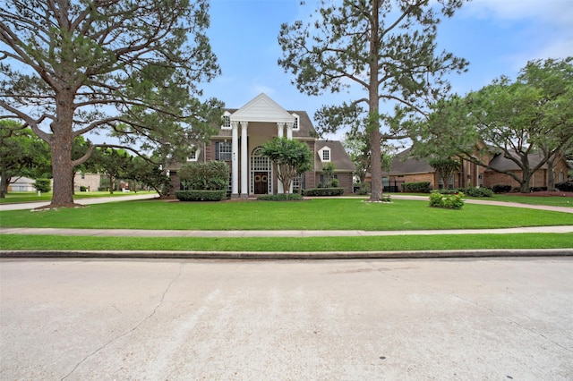 view of front of home with a front lawn