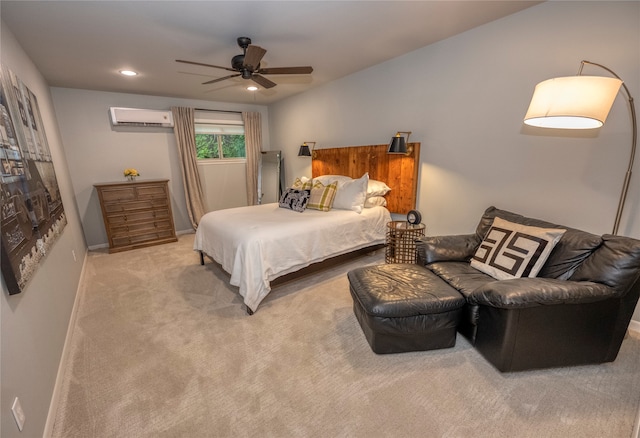 carpeted bedroom with a wall unit AC and ceiling fan