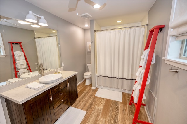 bathroom featuring hardwood / wood-style floors, vanity, and toilet