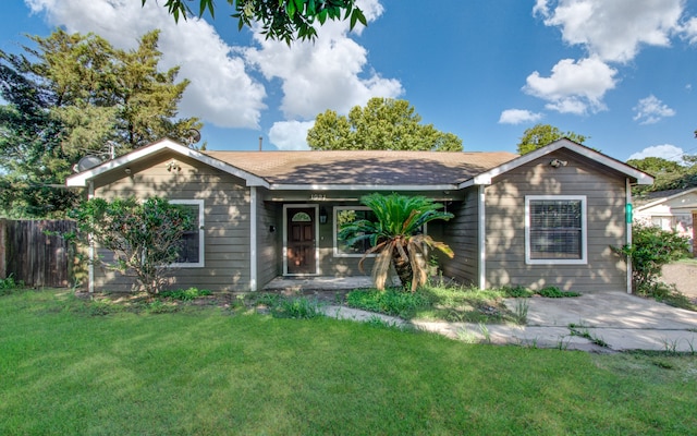 single story home with a front yard