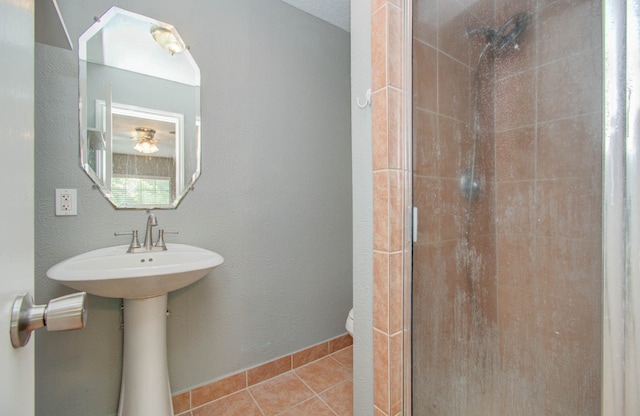 bathroom featuring a tile shower