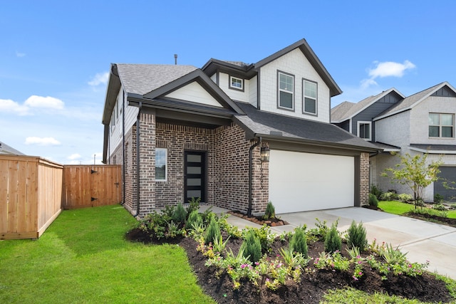 view of front of house featuring a front lawn and a garage