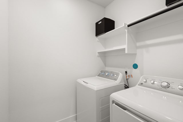 washroom with washer and clothes dryer