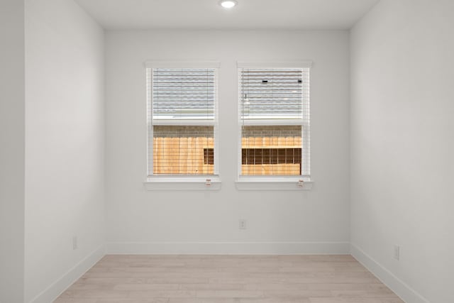 empty room featuring light hardwood / wood-style floors and a wealth of natural light