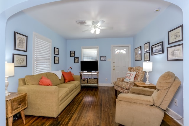 living room with dark hardwood / wood-style floors and ceiling fan