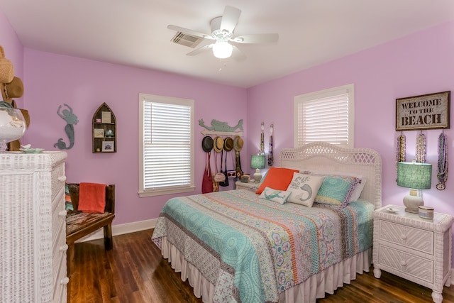 bedroom with ceiling fan and dark wood-type flooring