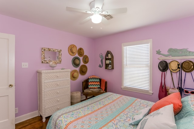 bedroom featuring ceiling fan and dark wood-type flooring