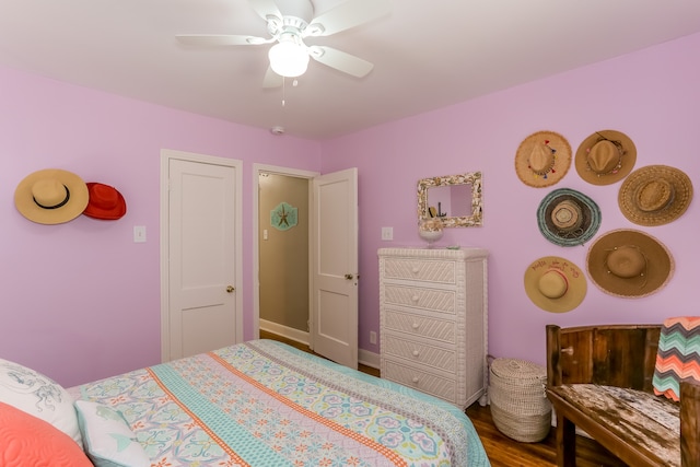 bedroom with hardwood / wood-style flooring and ceiling fan