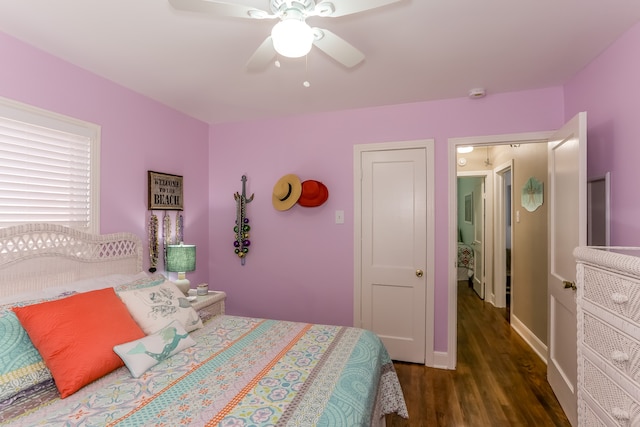 bedroom with ceiling fan and dark hardwood / wood-style flooring