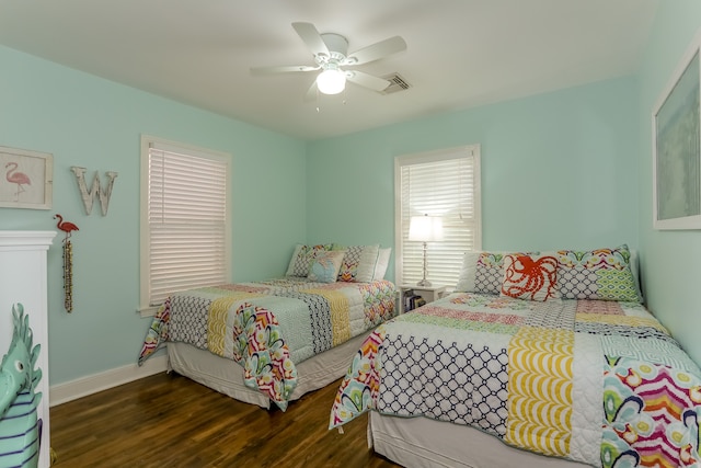 bedroom featuring dark wood-type flooring and ceiling fan