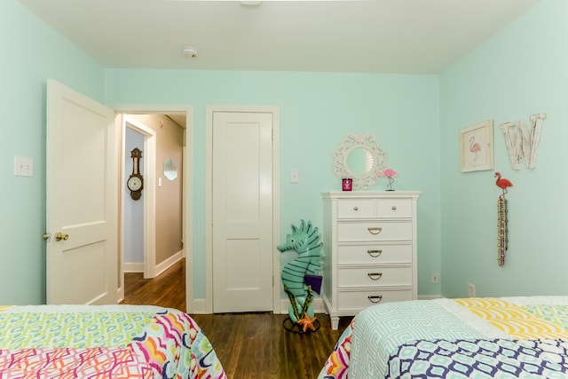 bedroom featuring dark hardwood / wood-style flooring