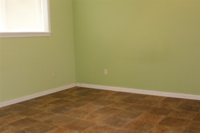 view of tiled spare room