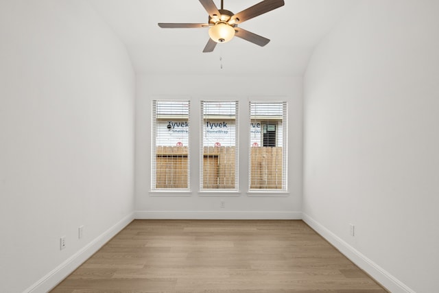 unfurnished room with lofted ceiling, light hardwood / wood-style flooring, and ceiling fan