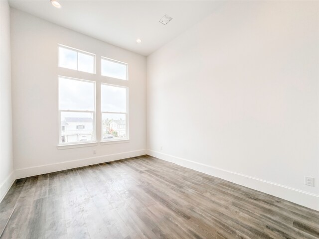 unfurnished room featuring hardwood / wood-style flooring