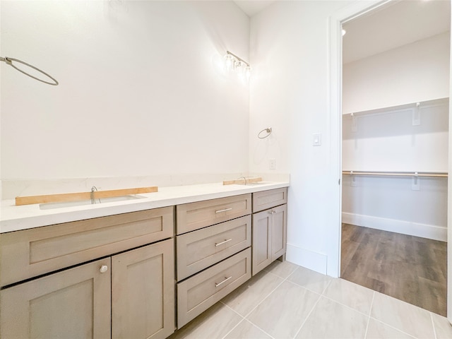 bathroom with tile patterned floors and vanity