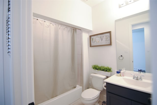 full bathroom featuring toilet, vanity, and shower / tub combo with curtain