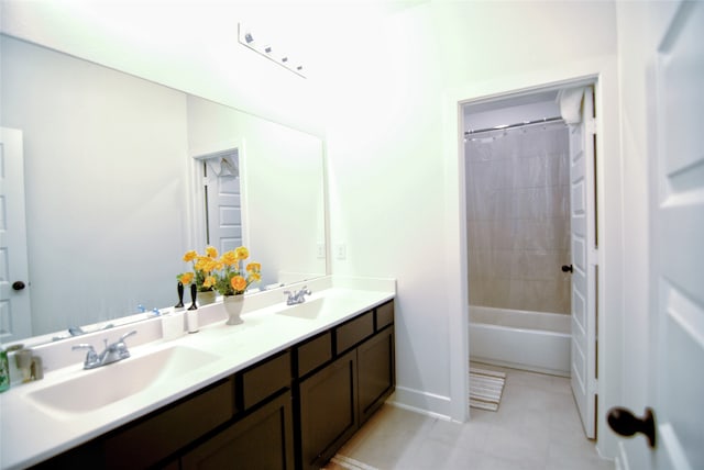 bathroom with shower / bath combination with curtain, tile flooring, and double vanity