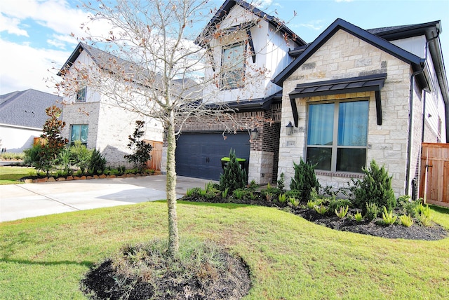 view of front of property with a garage and a front lawn