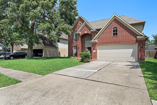 view of front property with a garage and a front yard