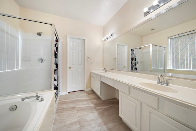 bathroom featuring plus walk in shower and vanity