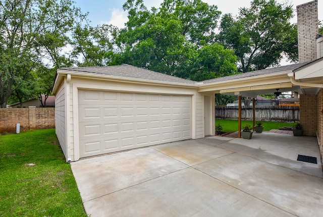 garage with a lawn