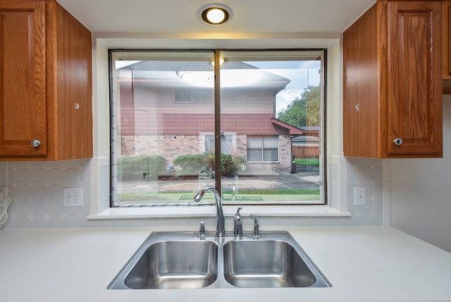 kitchen with backsplash and sink