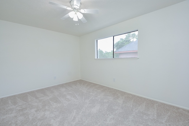 empty room with carpet and ceiling fan