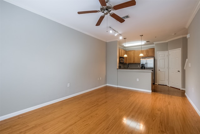 unfurnished living room featuring light hardwood / wood-style flooring, ceiling fan, track lighting, sink, and ornamental molding