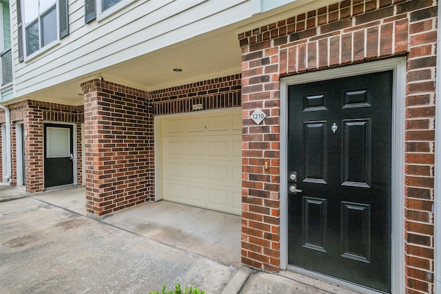 view of exterior entry featuring a garage