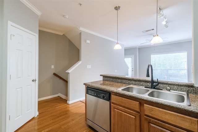 kitchen with a healthy amount of sunlight, light hardwood / wood-style flooring, dishwasher, and sink