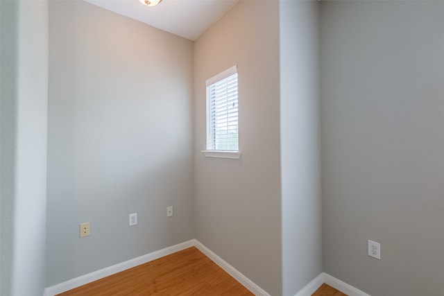 spare room with wood-type flooring