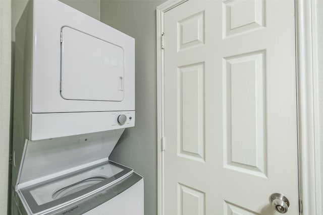 laundry room featuring stacked washer / dryer