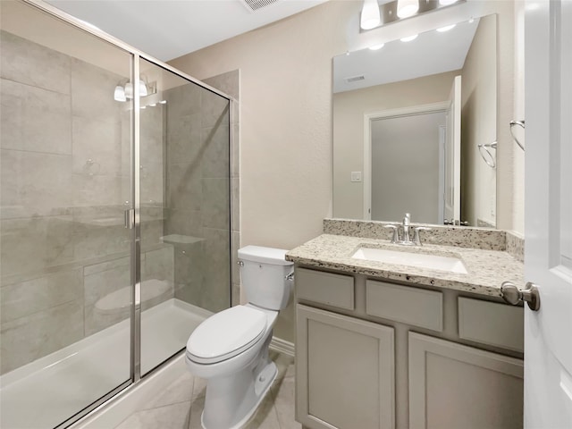 bathroom with walk in shower, toilet, tile flooring, and vanity